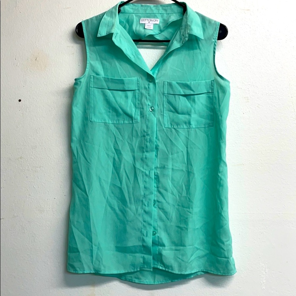 Back cut out sleeveless blouse